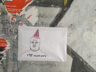 advertisement flag:transgender_pride_flag glasses irl_background operation_reality party_hat soyjak soyjak_party stubble transgender_flag transheart variant:unknown white_skin // 4032x3016 // 4.6MB