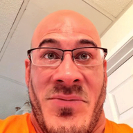 animated bald blinking closed_mouth clothes glasses irl looking_at_you mustache orange_shirt stubble subvariant:neutralplier variant:markiplier_soyjak // 400x533 // 358.7KB