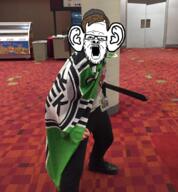 4chan 4cuck beard brown_hair clothes ear eyebrows flag glasses hair irl kekistan open_mouth sword variant:a24_slowburn_soyjak // 1113x1200 // 2.0MB