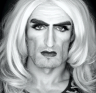 black_and_white blond drag dress forehead_mark gigachad grey_background irl jawline looking_at_you makeup meta:not_oc monochrome nas:gigachad no_glasses stubble subnas:gigatroon tranny white_skin wig // 255x247 // 134.9KB