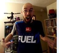 arm bald balding beard book bookshelf clothes d.va_(overwatch) dallas_fuel ear excited figurine fingernail glasses hat helmet internet_is_leaking irl irl_soy jack_in_the_box lamp logo looking_at_you open_mouth overwatch pointing reaper_(overwatch) series:irl_soyjaks shelf soyboy soyjak teeth text tongue tshirt variant:shirtjak variant_origin video_game white_skin // 618x559 // 452.6KB