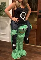 amphibian big_breasts blond breasts costume english_text female frog full_body irl irl_background nas:pepe pepe pepe_the_frog qanon text troon // 871x1280 // 171.1KB