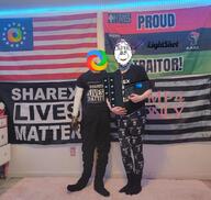 american_flag arm bbc betsy_ross_flag black_lives_matter carpet country drawer flag full_body glasses hair hand holding_object irl_background kris_kane pan_african power_outlet purple_hair queen_of_spades sharex smile soyjak star stubble united_states variant:bernd // 1080x1021 // 1.3MB