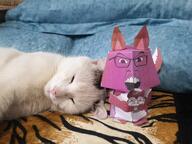 2soyjaks animal bloodshot_eyes brown_eyes brown_skin cat crying ear food full_body glasses holding_object irl mustache nut open_mouth origami paper po_(4chan) soyjak stubble subvariant:feralsquirrel trend:squirreljakking variant:bernd variant:feraljak // 4032x3024 // 3.1MB