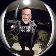 ai_generated clothes glasses holding_gun irl_background realistic rifle smile smirk tshirt variant:chudjak // 1024x1024 // 1.4MB