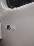 advertisement beanie blue_eyes clothes irl_background open_mouth operation_reality pointing soyjak_party sticker text variant:soytan // 1944x2592 // 2.5MB