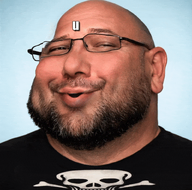 animated beard black_shirt clothes glasses laughing mazeltv mazeltv_(namefag) meta:ai_generated mug_life realistic skull subvariant:masscholar subvariant:massjak subvariant:scholar talking teeth text u_mad_bro variant:gapejak