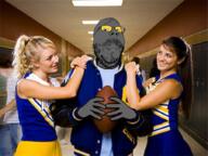 american_football arm college football glasses grey_skin hand holding_object irl mustache smile soot soot_colors soyjak soyjak_party stubble variant:gapejak // 900x674 // 759.2KB