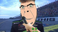 4chan brandon_brown glasses green_eyes hand irl irl_background lets_go_brandon logo microphone nascar smile soyjak stubble variant:cobson white_skin zoomer // 1280x720 // 163.2KB