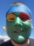 blue_skin brown_hair carnival colorful ear face_paint glasses green_skin grin hair irl red_skin smile stubble variant:unknown white_skin yellow_skin yellow_teeth // 2208x2944 // 1.7MB