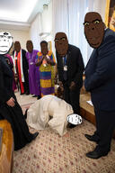 bbc biting_lip black_skin bnwo christianity facial_mark forehead_mark glasses irl_background open_mouth pope queen_of_spades smile soyjak spade stubble subvariant:hornyson variant:cobson yellow_sclera // 1125x1687 // 541.3KB