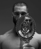 beard eyebrows gigachad hair holding_object looking_at_you mirror monochrome muscles nas:gigachad