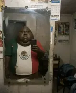 bald black_skin calendar clothes fat flag:mexico holding_object holding_phone meta:ai_generated meta:not_oc mirror obese phone tshirt variant:meximutt // 1179x1433 // 159.7KB