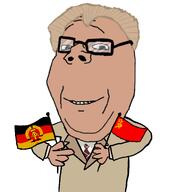 blonde_hair_ commie communism ddr east_germany erich_honecker flag flags gdr germany glasses happy holding_object jacket socialism soviet_union soyjak subvariant:wholesome_soyjak uniform variant:gapejak // 2048x2048 // 1.1MB