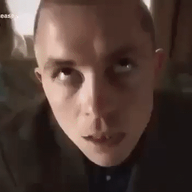 animated blackpilled channel_4 closed_mouth clothes glasses hair irl irl_background morph open_mouth pill smug subvariant:chudjak_front variant:chudjak white_skin // 600x330 // 12.9MB