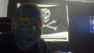 blue_skin brown_hair carnival colorful ear face_paint glasses green_skin hair irl open_mouth red_skin skull_and_bones soyjak stubble variant:unknown white_skin yellow_skin // 1280x720 // 126.0KB