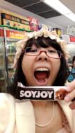 asian candy chocolate female glasses hair holding_object irl japanese_text large_nose open_mouth soy soyjak soyjoy text tongue variant:joyjak // 539x960 // 661.5KB