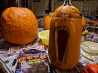 animal clothes glasses halloween hat irl knife mustache open_mouth pumpkin smile soyjak stubble text variant:reaction_soyjak wing // 640x480 // 804.0KB