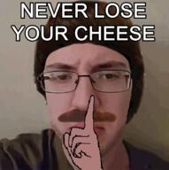 barneyfag closed_mouth glasses hair hand irl lee_goldson looking_at_you mustache patrick_crusius shushing text variant:chudjak // 803x806 // 311.6KB