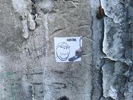 advertisement glasses graffiti irl irl_background meta:tagme operation_reality paper remote sharty smile soyjak soyjak_party sticker stubble subvariant:wholesome_soyjak television tv_remote variant:gapejak wholesome // 4000x3000 // 6.3MB