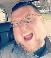 angry beard blue_eyes brown_beard clothes ear fat glasses hair irl irl_soy jake_brantner meta:variant_origin open_mouth series:irl_soyjaks soyboy variant:shotjak white_skin // 299x339 // 169.2KB