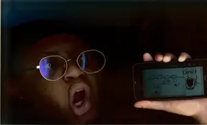 a24 slowburn soyjak, markiplier soyjak, soyak, two pointing soyjaks, phoneplier horizontal, showing phone, arm, closed mouth, glasses, hands