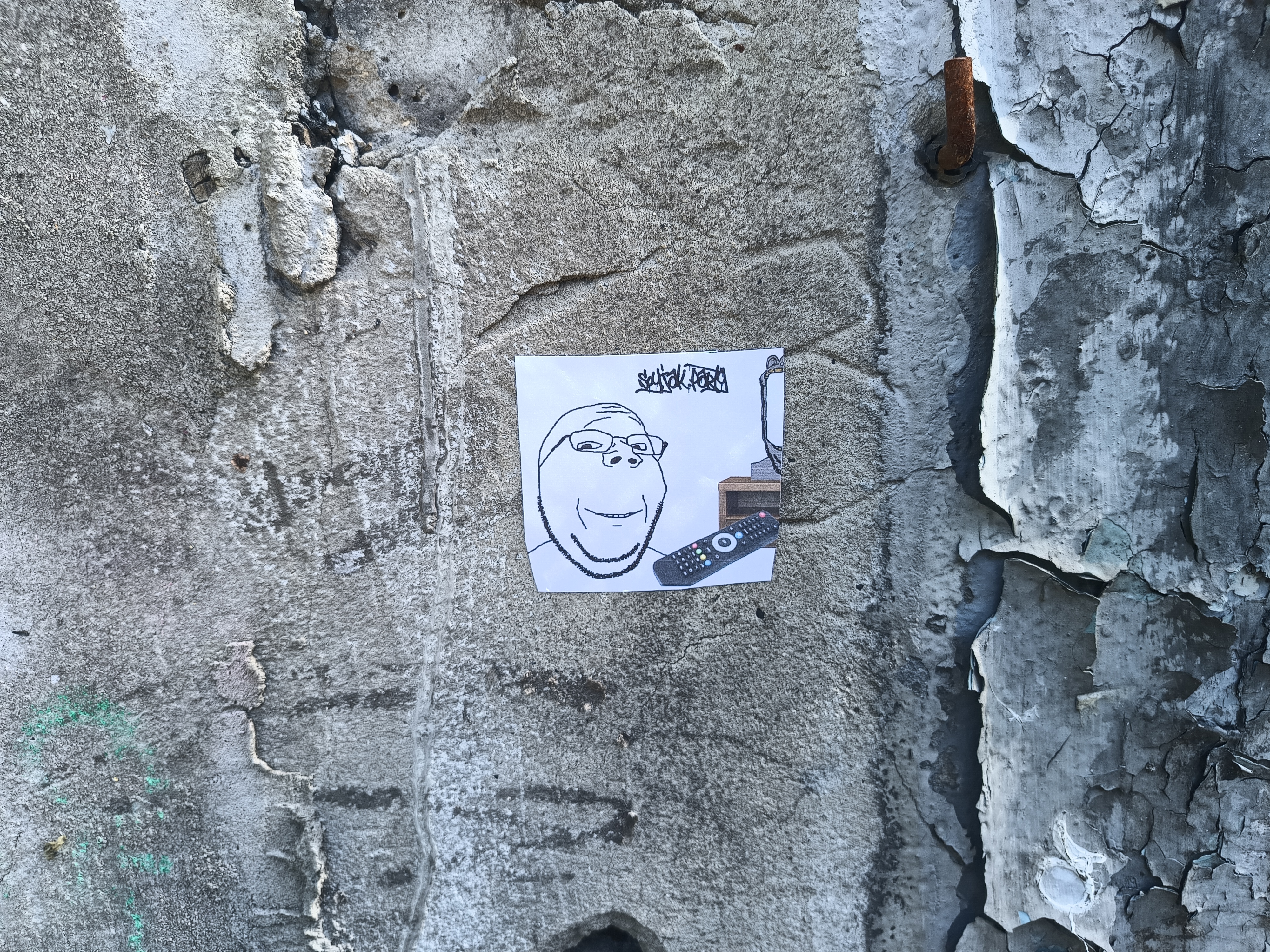 gapejak, wholesome soyjak, advertisement, glasses, graffiti, irl background, operation reality, paper, real life, remote