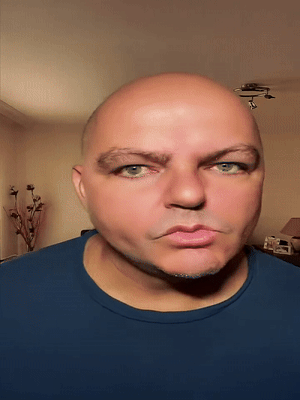 flartson, irl soyjaks, animated, bald, blue shirt, closed mouth, ear, eyebrows, flart, green eyes