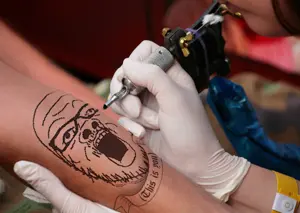a24 slowburn soyjak, glasses, merchandise, mustache, open mouth, real life, soyjak, stubble, tattoo, text