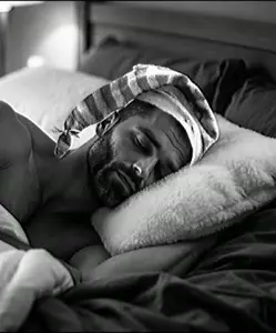 gigachad, beard, bed, bedsheets, black eyes, black hair, blanket, buff, closed eyes, closed mouth