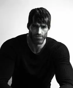 gigachad, beard, black hair, black shirt, buff, closed mouth, clothed, clothes, ernest khalimov, front view