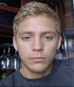 zjak, beard, blonde hair, blue eyes, closed mouth, front view, hair, irl background, looking at you, neutral