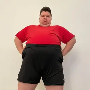 nikocado avocado, 1nas, almost full body, angry, arm, big shorts, black hair, black shorts, chin, closed mouth