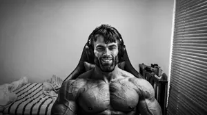gigachad, beard, foodistzen, gray skin, grayscale, hair, shirtless, sitting at computer, smile, teeth