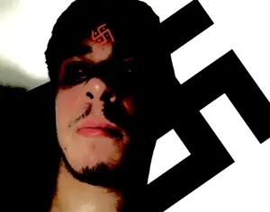 black hair, closed mouth, hair, half body, hindu, hindu swastika, indo-aryan, irl background, irl person, nazism