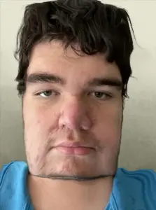 grotesque steve, steve (minecraft), karajak, 1soyjak, big nose, blue shirt, front view, grotesque steve, in real life, irl background