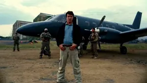bane, 1nas, baneposting, belt, black jacket, blue shirt, brown hair, camouflage, central intelligence agency, closed mouth