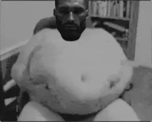 gigachad, gigachaded, almost full body, beard, belly, big, black eyes, black hair, bookshelf, chair