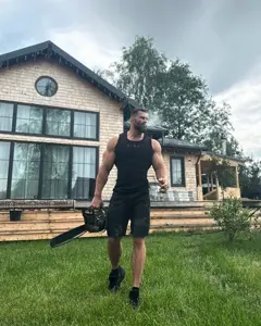 gigachad, 1nas, beard, black hair, buff, chainsaw, closed mouth, clothed, clothes, cloud
